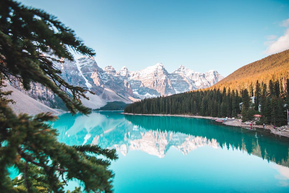 Idyllic view of Moraine Lake reflecting mountains and forests in Banff National Park, Canada